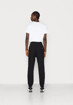 YOURTURN UnisexPantaloni SportiviBlack Donna Pantaloni YO12100OR-Q11 -Yourturn 93239351f3ae4382bd2bf96cade29d39 scaled